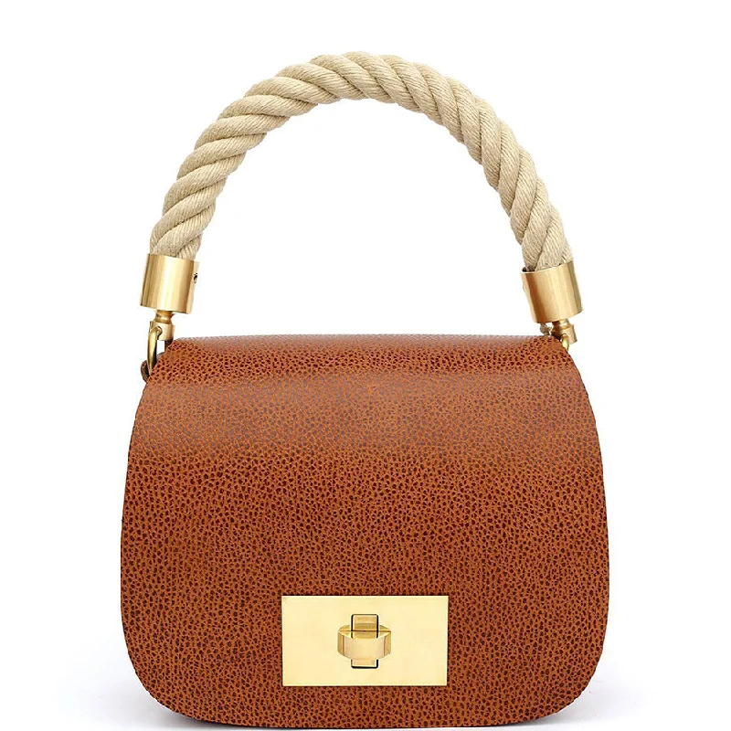 VEGETABLE TANNED LEATHER BAG "THE SADDLE" IN EMBOSSED COGNAC