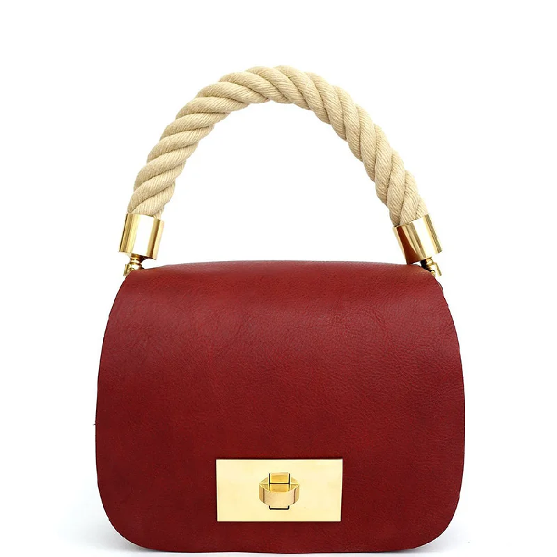 VEGETABLE TANNED LEATHER BAG "THE SADDLE" IN RED